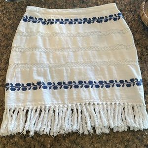 Boho skirt white with blue embroidery and fringe trim. Outdoor concert ready!